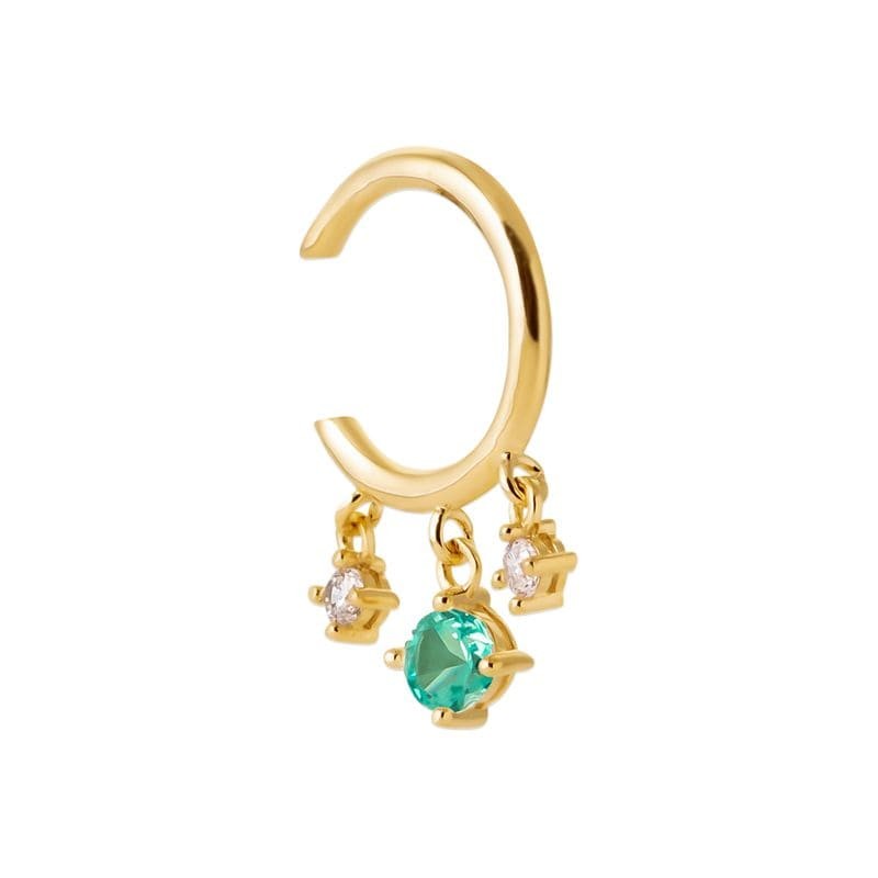 bague d'oreille dorée et pierre verte