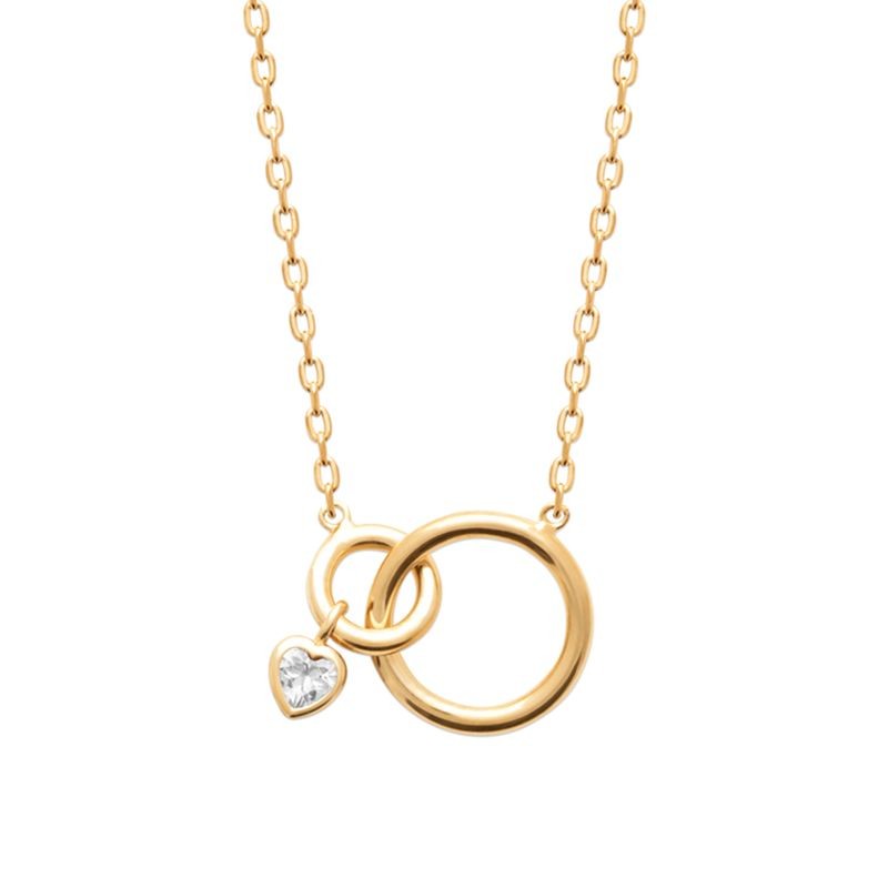 Détail collier plaqué or motif anneaux asymétriques et cœur serti de zircon